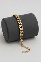 7mm Gold-tone Cuban Link Bracelet — stand — Gold-tone