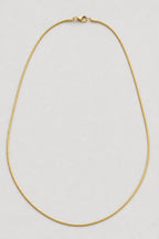 1mm Gold‑Tone Snake Chain — presentation — gold‑tone