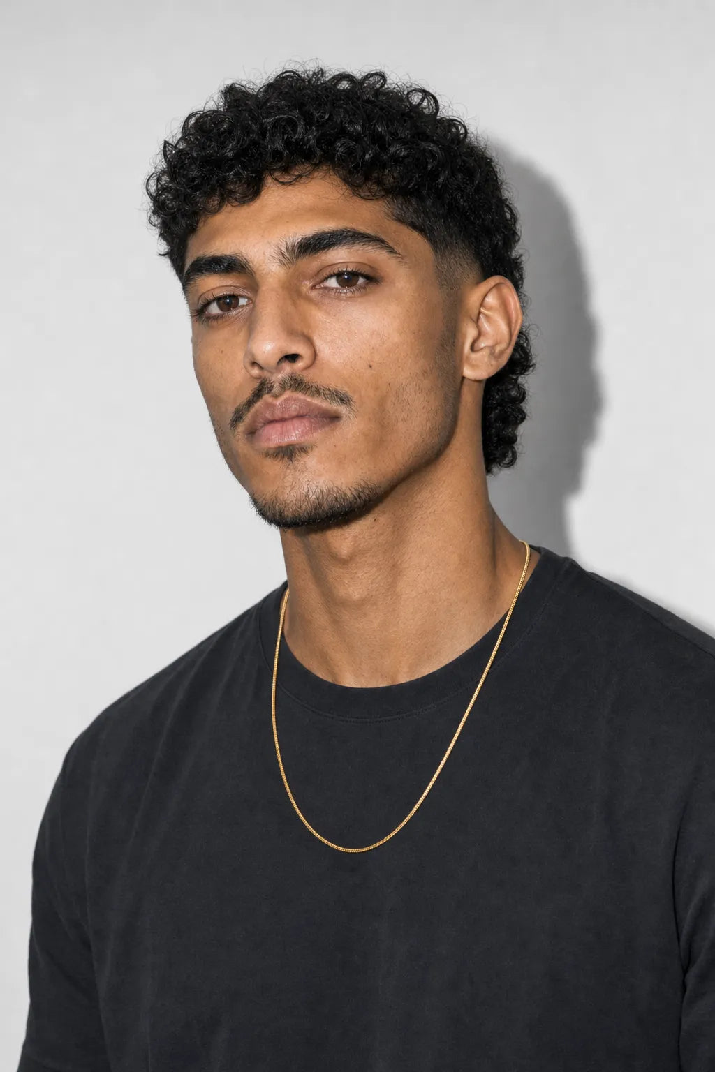 2mm gold snake chain — worn — gold color
