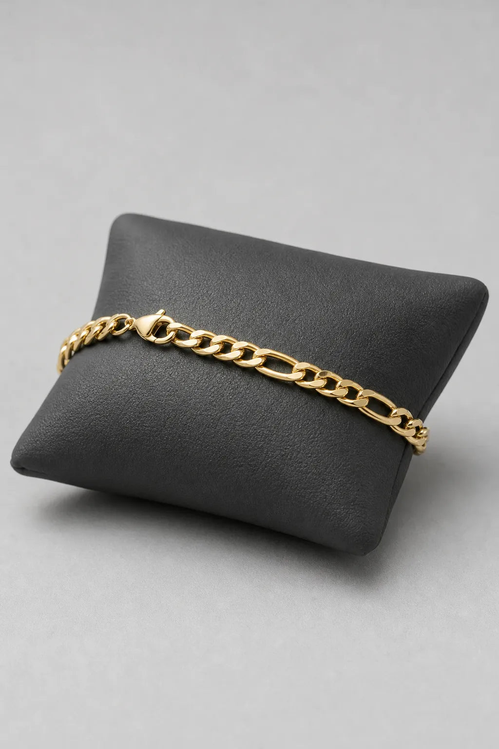 Gold-tone Figaro Bracelet — stand — gold-tone