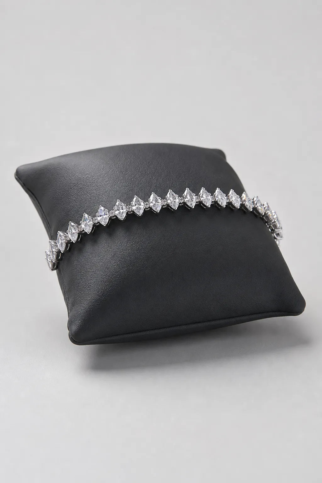 Marquise Tennis Bracelet — Main - silver-tone marquise CZ line — on a display cushion