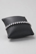 Marquise Tennis Bracelet — Main - silver-tone marquise CZ line — on a display cushion