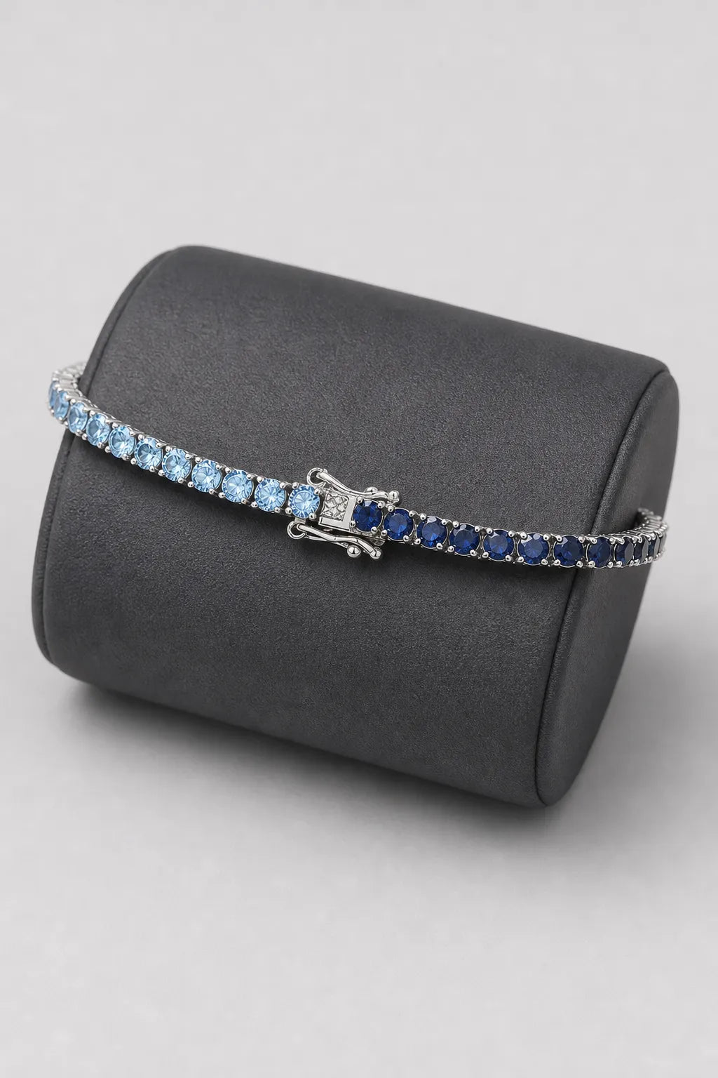 Two Tone Tennis Bracelet — Main — two tone blue tennis bracelet — on a display cushion