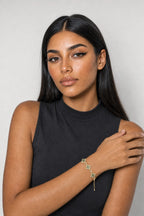 Flower Tennis Bracelet — Gold-tone with green centres (primary) — worn on an adult wrist