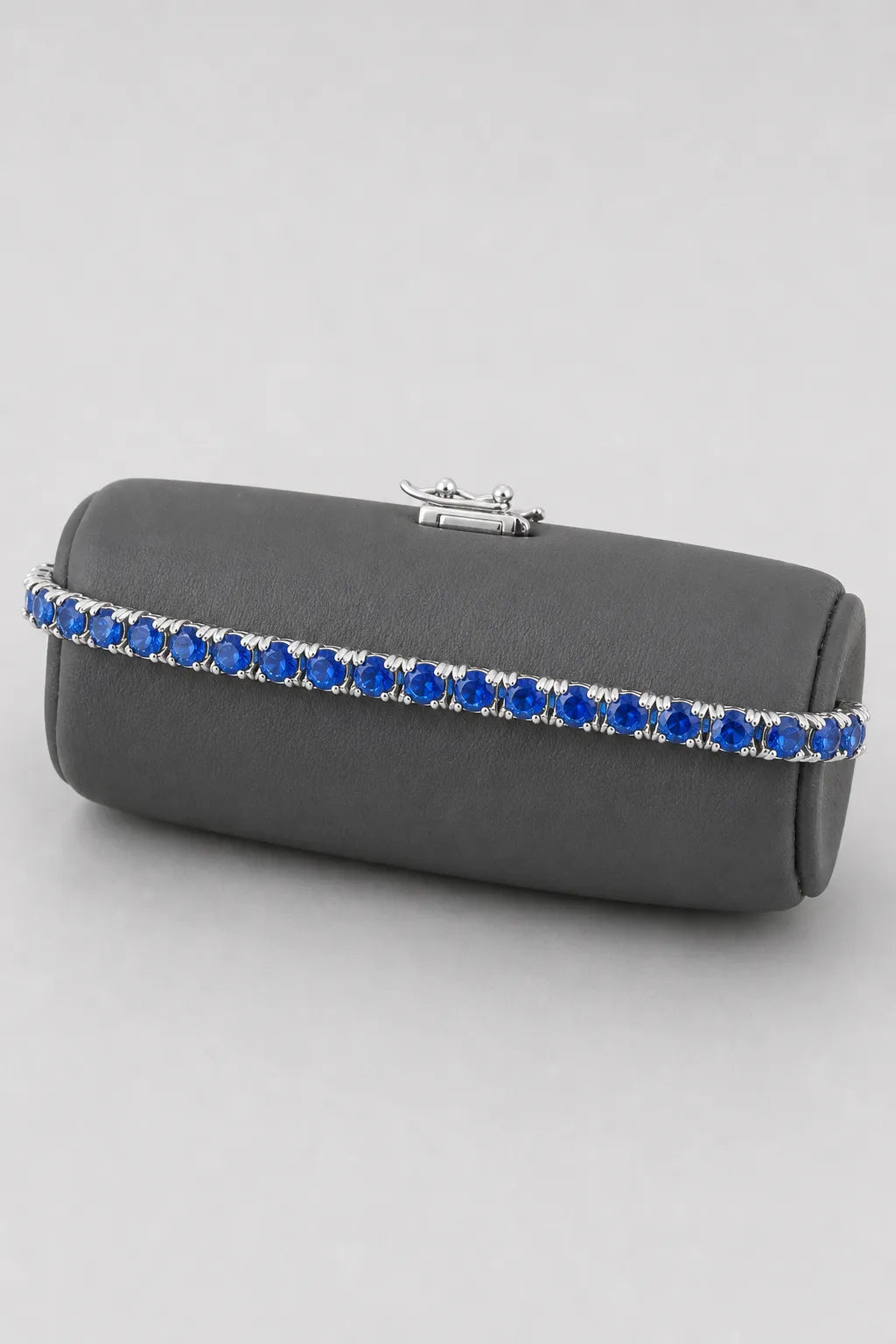 Blue Tennis Bracelet — 3mm — sapphire-blue stones — on a display cushion