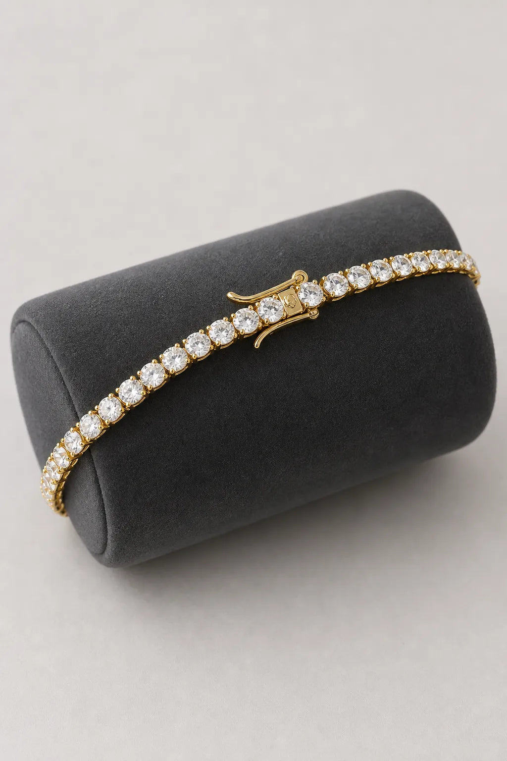 5mm Tennis Bracelet — 5mm tennis bracelet — gold-tone (main) — on a display cushion