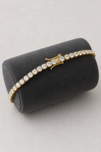 5mm Tennis Bracelet — 5mm tennis bracelet — gold-tone (main) — on a display cushion