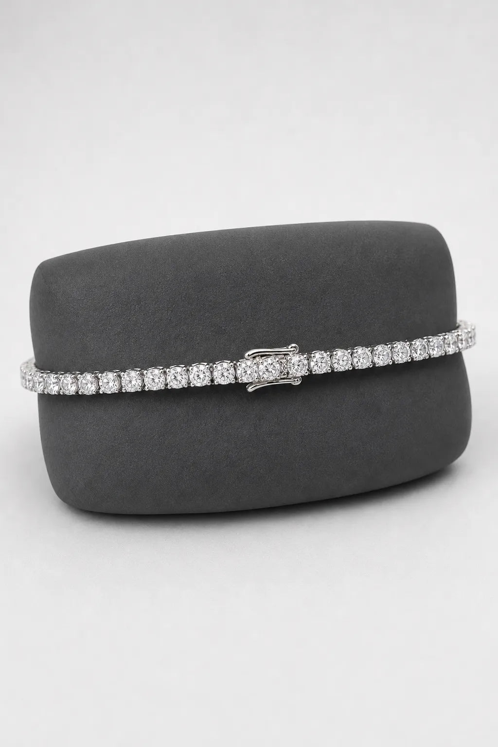 4mm Tennis Bracelet — 4mm silver-tone tennis bracelet — primary — on a display cushion