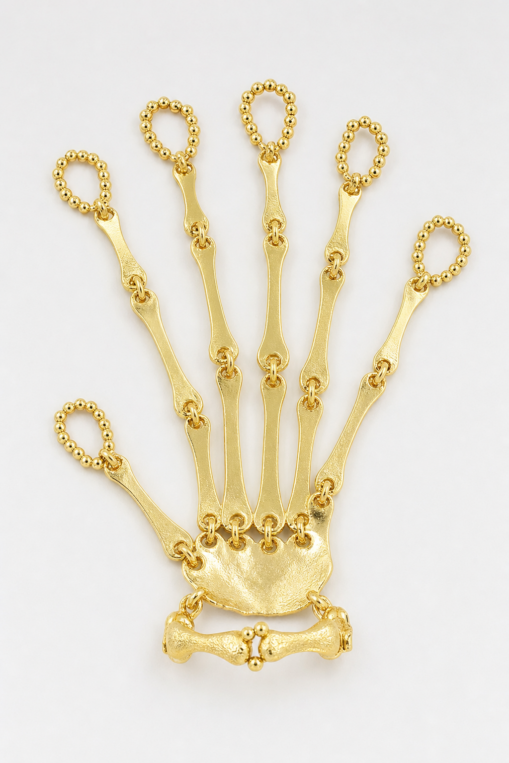 Bijoux Main de squelette — sur fond gris - couleur Or