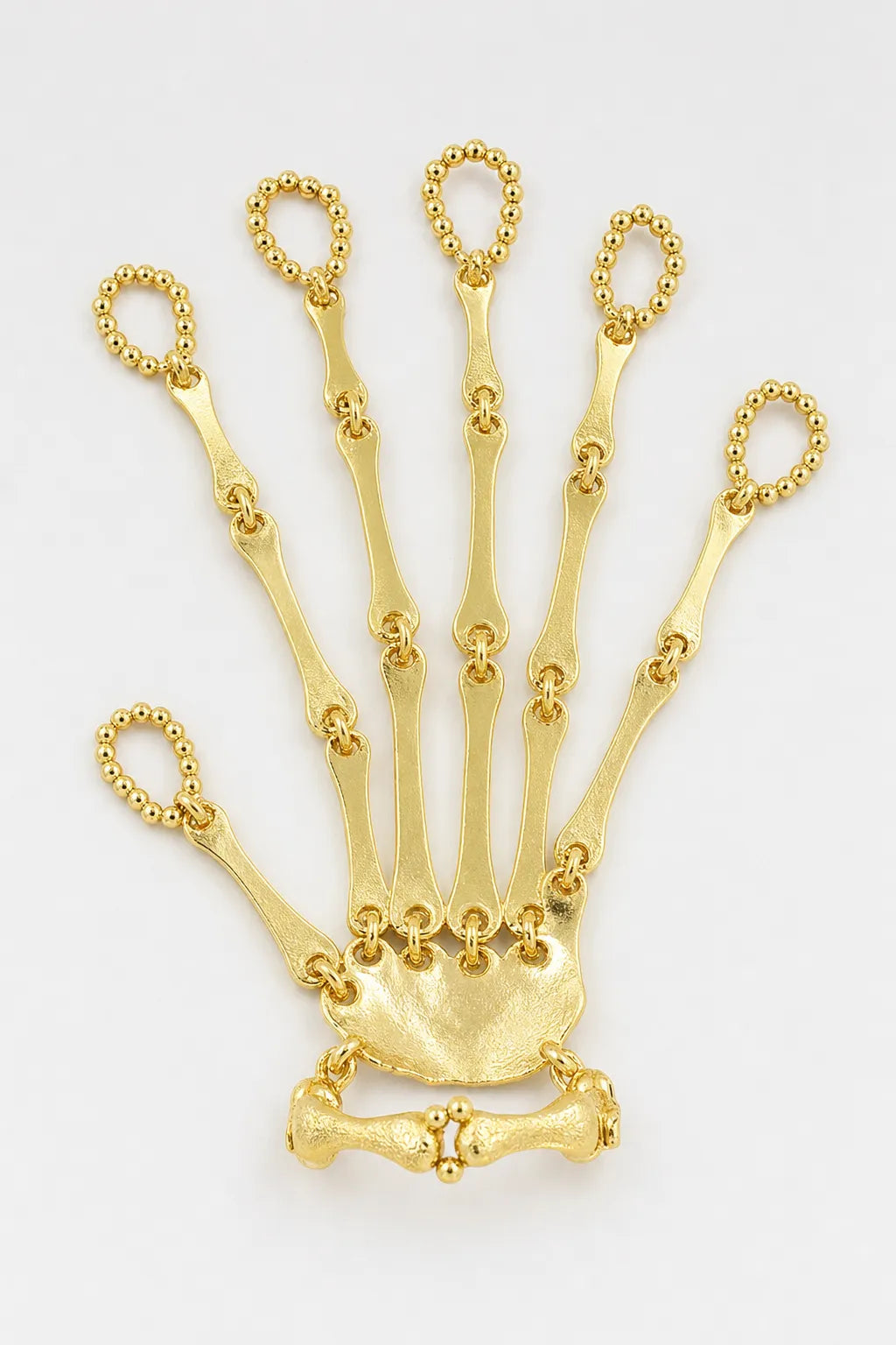 Bijoux Main de squelette — sur fond gris - couleur Or