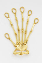 Bijoux Main de squelette — sur fond gris - couleur Or