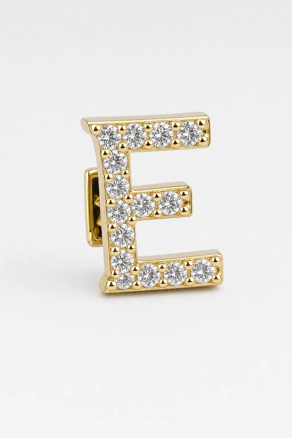 Grillz letters — sur fond gris - Or - lettre E