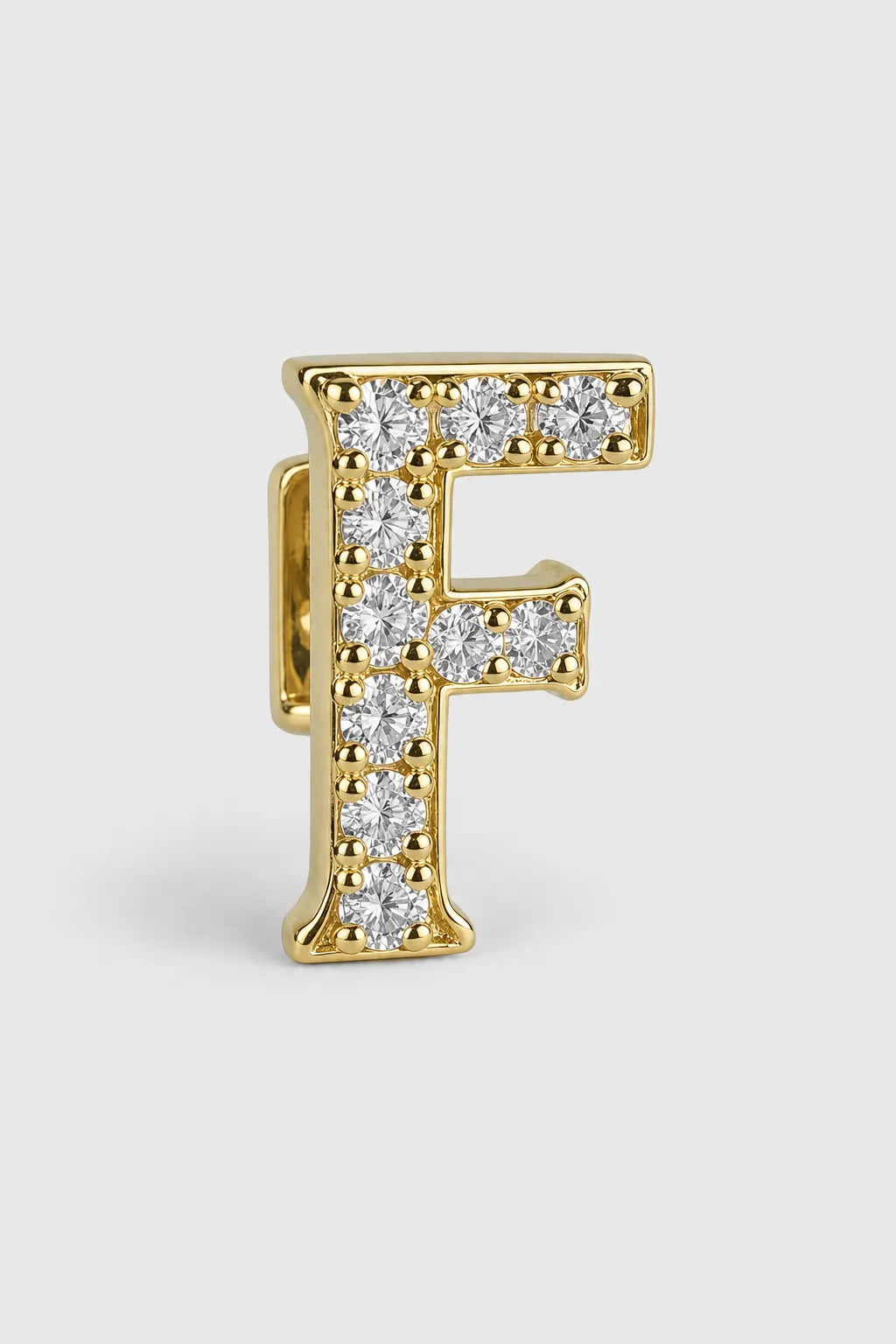 Grillz letters — sur fond gris - Or - lettre F