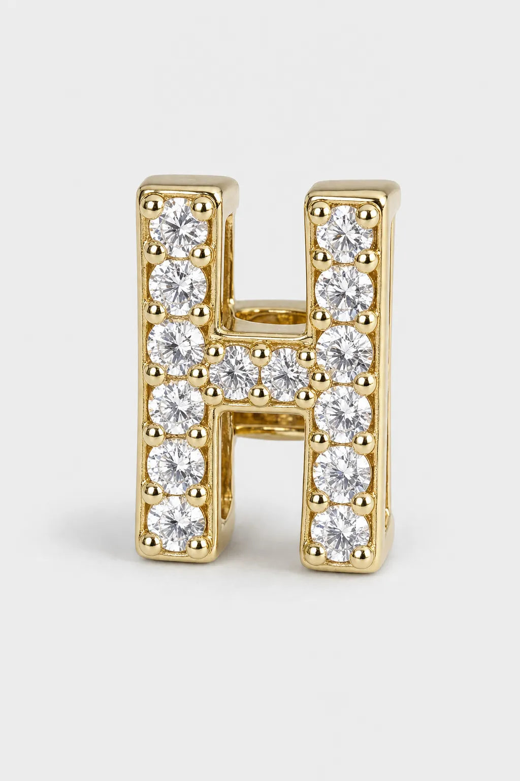Grillz letters — sur fond gris - Or - lettre H