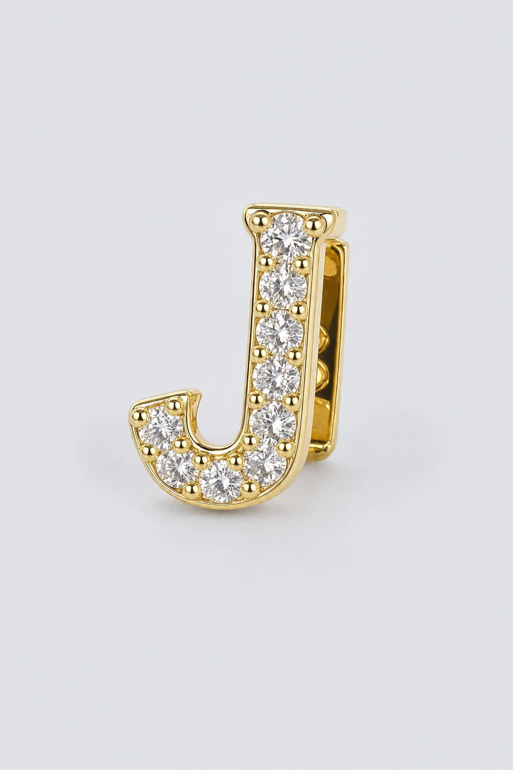 Grillz letters — sur fond gris - Or - lettre J