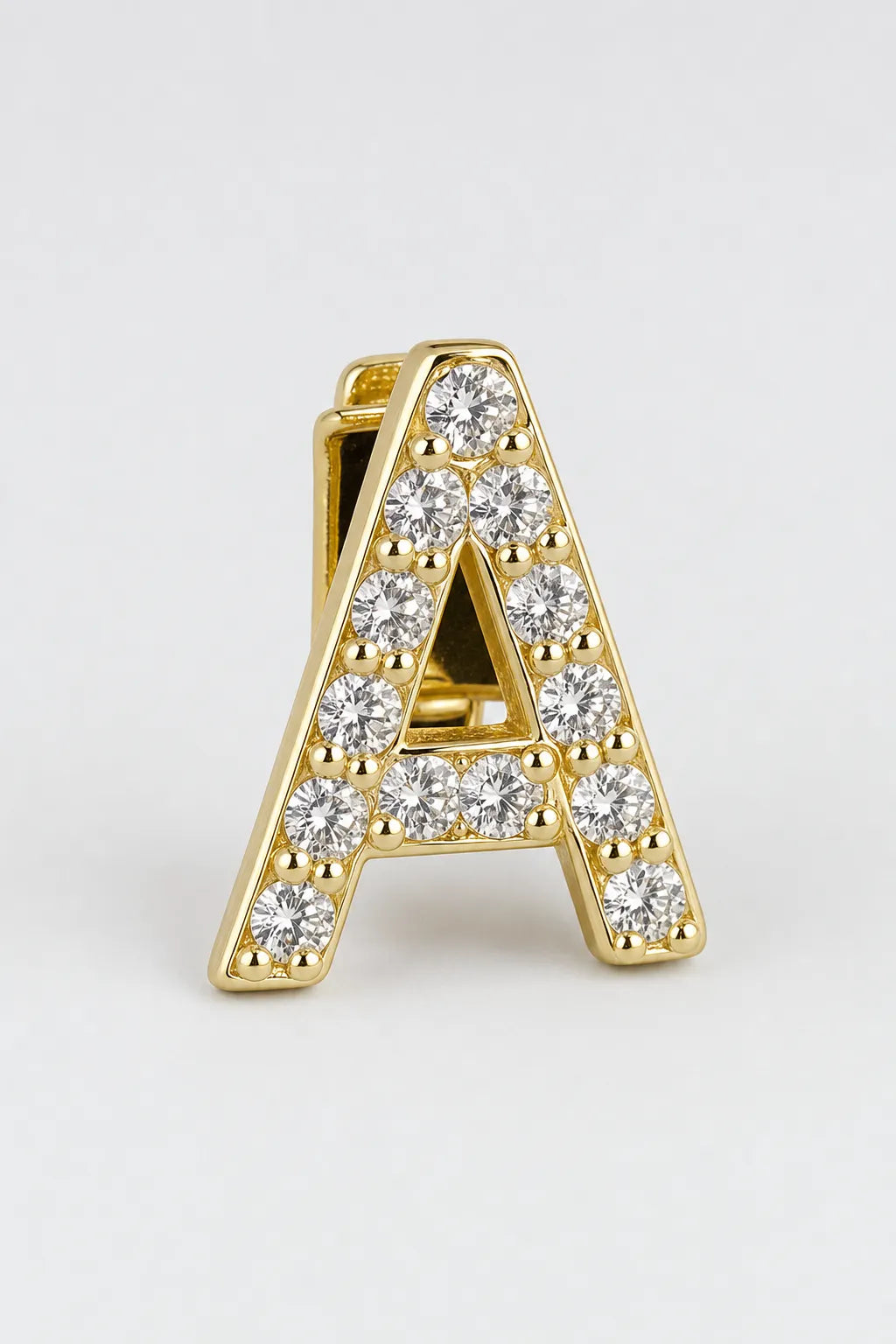 Grillz letters — sur fond gris - Or - lettre A
