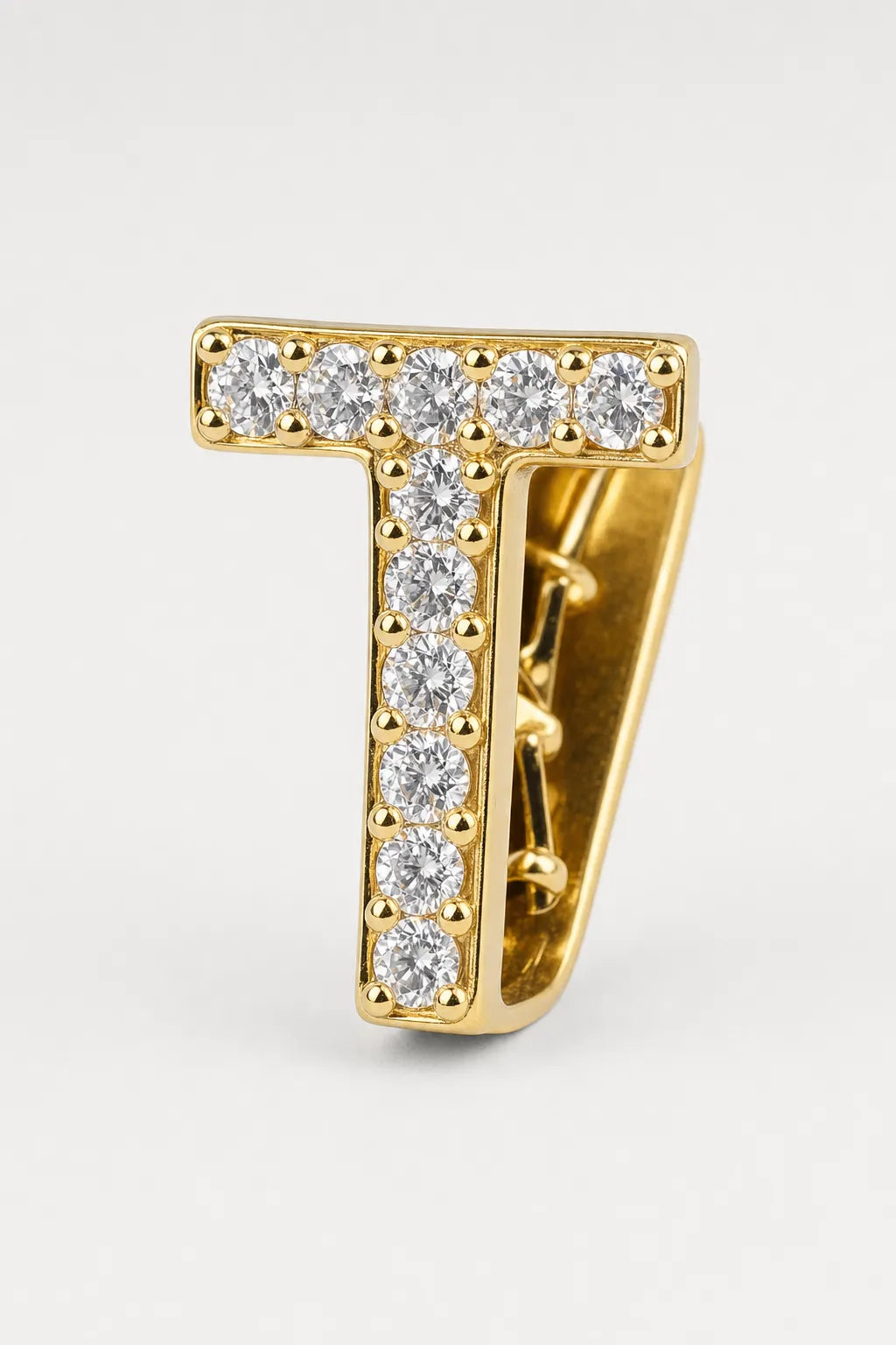 Grillz letters — sur fond gris - Or - lettre T