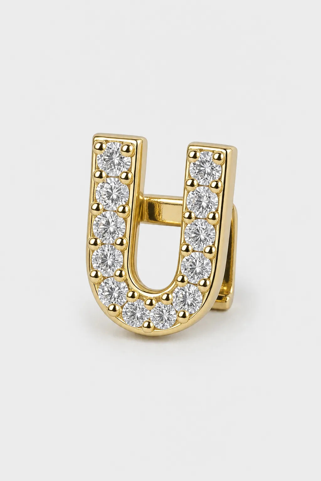 Grillz letters — sur fond gris - Or - lettre U