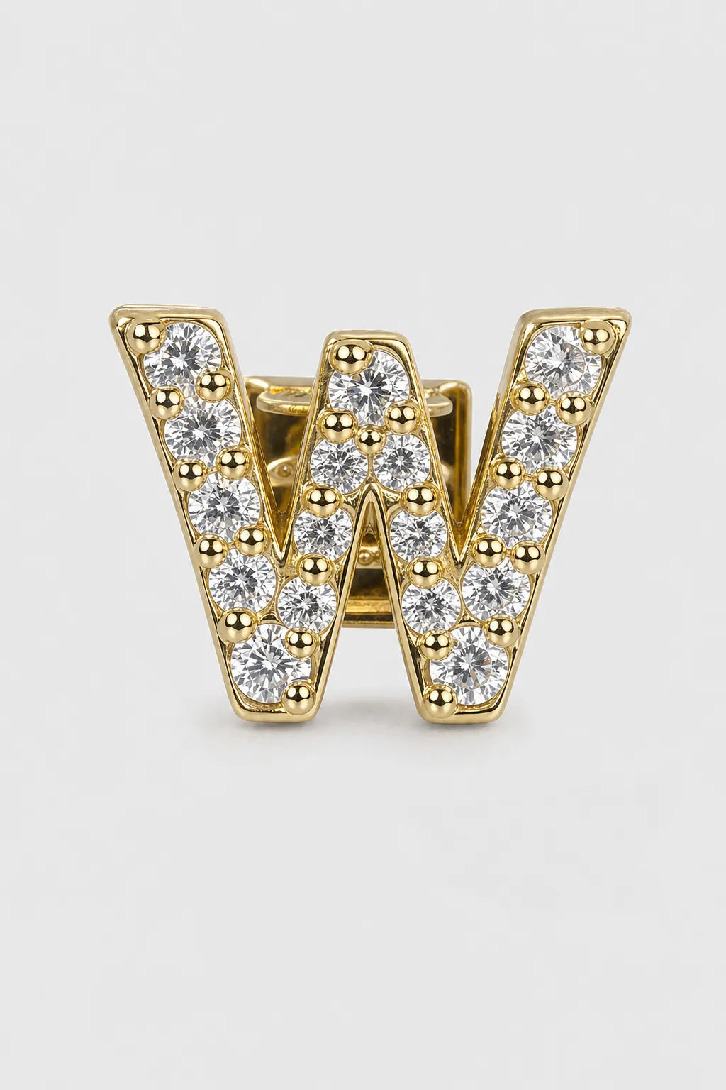 Grillz letters — sur fond gris - Or - lettre W
