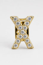 Grillz letters — sur fond gris - Or - lettre X