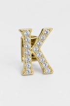 Grillz letters — sur fond gris - Or - lettre K