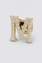 Grillz letters — sur fond gris - Or - lettre M