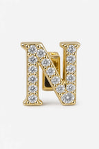 Grillz letters — sur fond gris - Or - lettre N