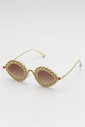 Lunette Pharrell Williams — sur fond gris - couleur Marron/Or